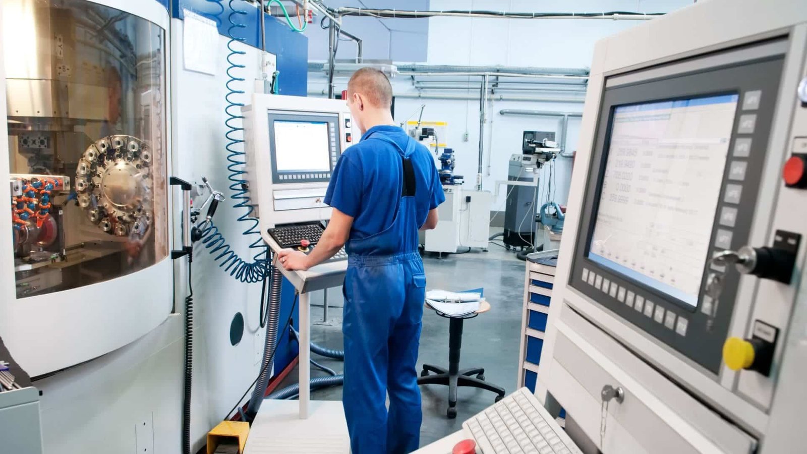 Worker Maintaining the Machining Center