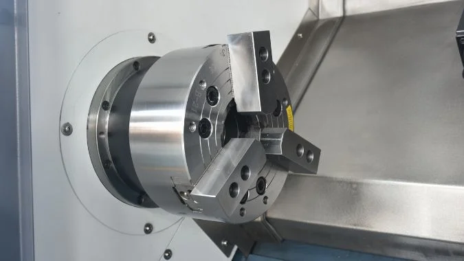 Close-up of 3-jaw chuck on a CNC lathe