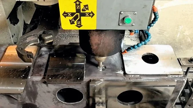 Closeup of profile machining center machining steel workpiece