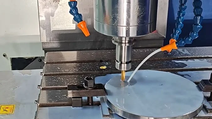 CNC machining center drilling a metal workpiece