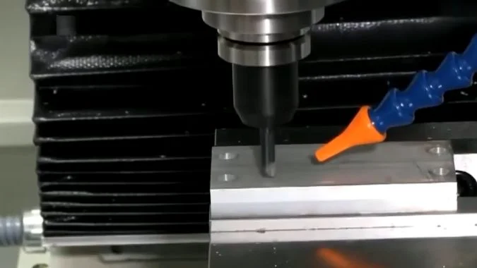 CNC machine cutting a metal workpiece