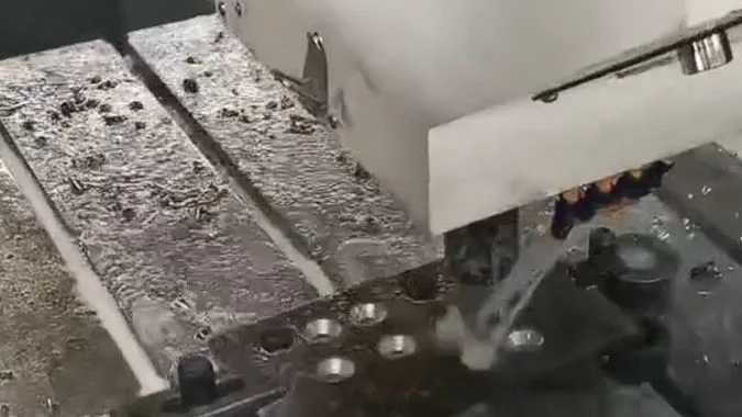 Closeup of high-speed CNC drilling machine drilling