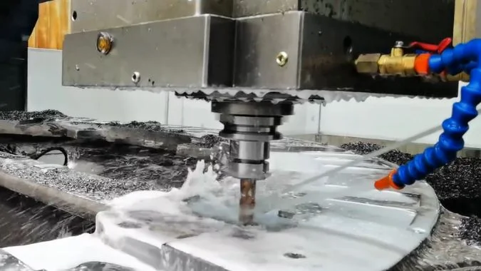 Closeup of fixed-beam GMC milling