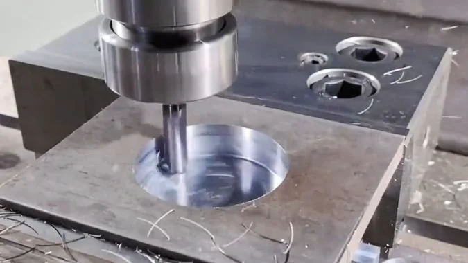 CNC milling machine machining a metal workpiece