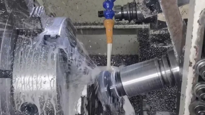 Coolant During Lead Screw Machining Coolant flushing the cutting area during lead screw machining