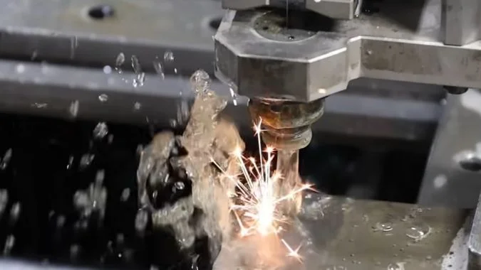 MS-WEDM machine cutting a metal workpiece