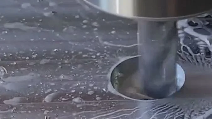CNC milling machine working on a metal hole