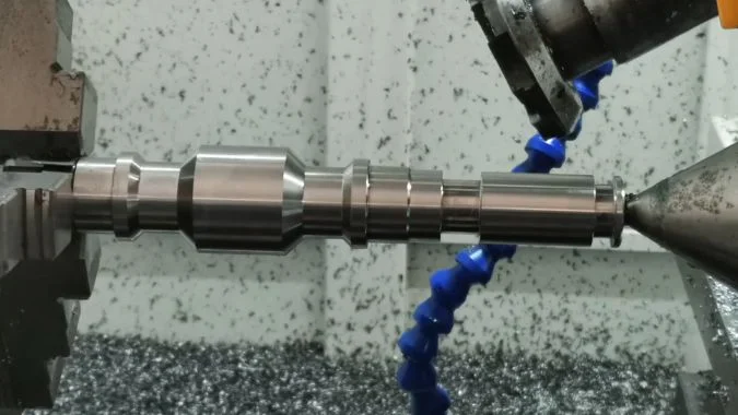 Lead Screw Blank Before Whirling Unthreaded lead screw blank held between centers before whirling