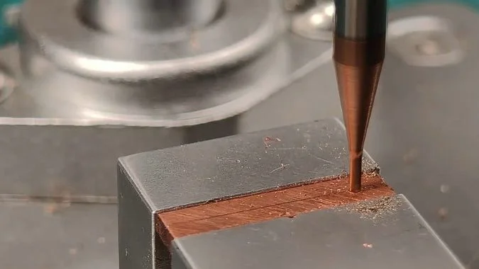 CNC milling machine machining a metal part